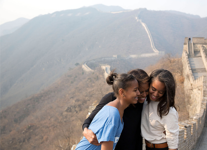 First lady Michelle Obama hugs daughters Sasha and Malia as they visit the Great Wall of China in Mutianyu, China, on March 23, 2014.Official White House Photo by Amanda Lucidon